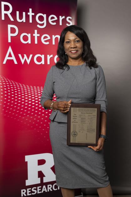 Dr. Strickland with her patent plaque